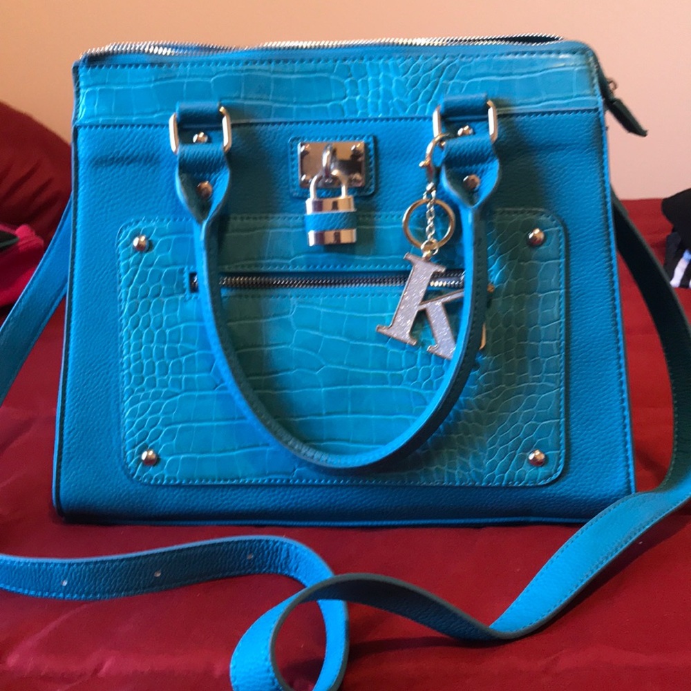 Large teal purse. Can be a shoulder or crossbody.